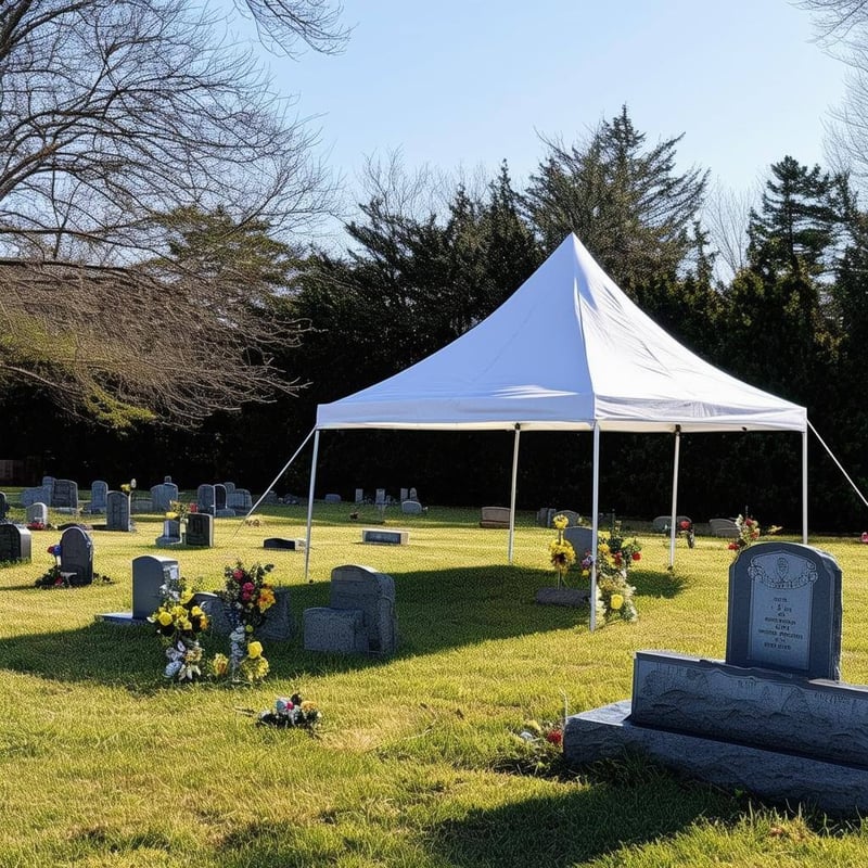 A tent setup next to a grave site for a funeral