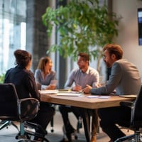 people meeting at a desk